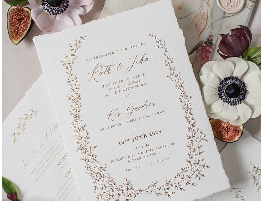 gold foil leafy boarder wedding invite