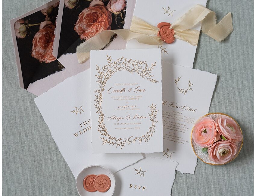 Gold foil fine art wedding invite with floral envelope liner