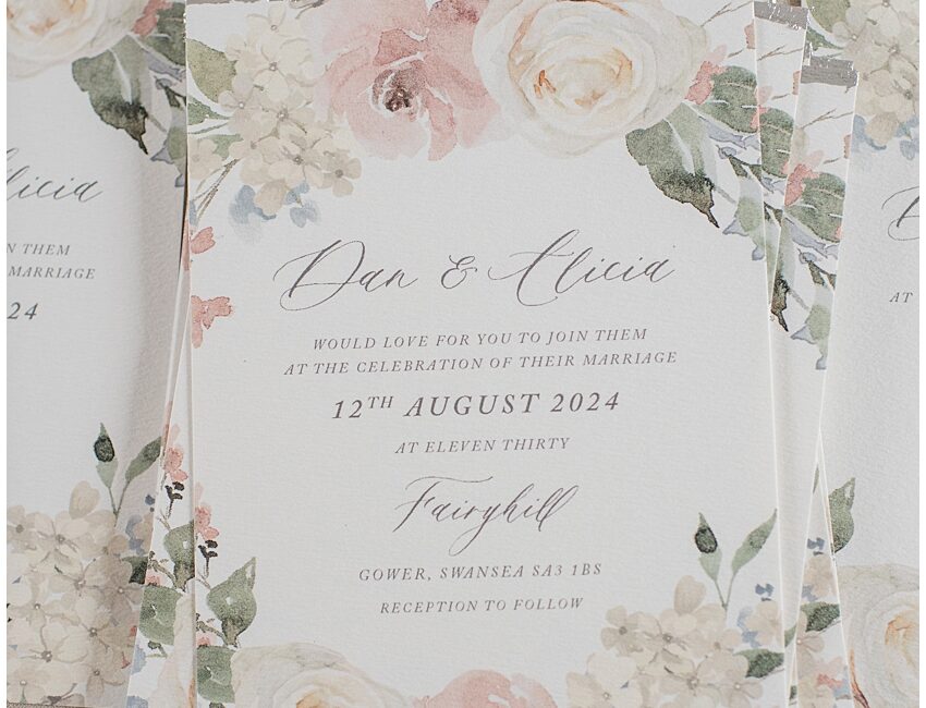 Silver foil wedding invitations with floral details