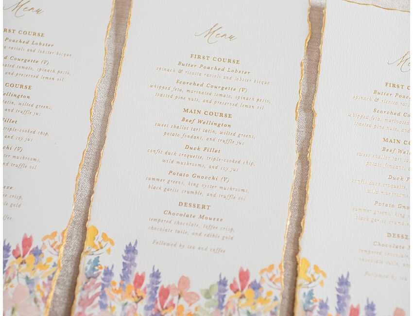 Wild flower wedding menus pressed in gold with gold edges perfect for a sprint or summer wedding