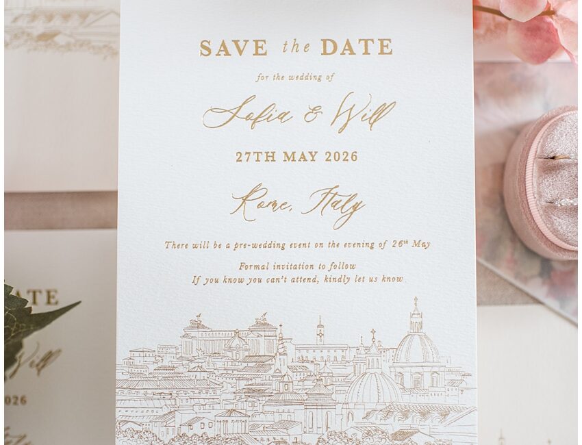 Hand drawn illustration of Rome, Italy for bespoke save the date wedding invitations. Gold foil pressed save the date wedding stationery. Oval diamond engagement ring and coral silk ribbon