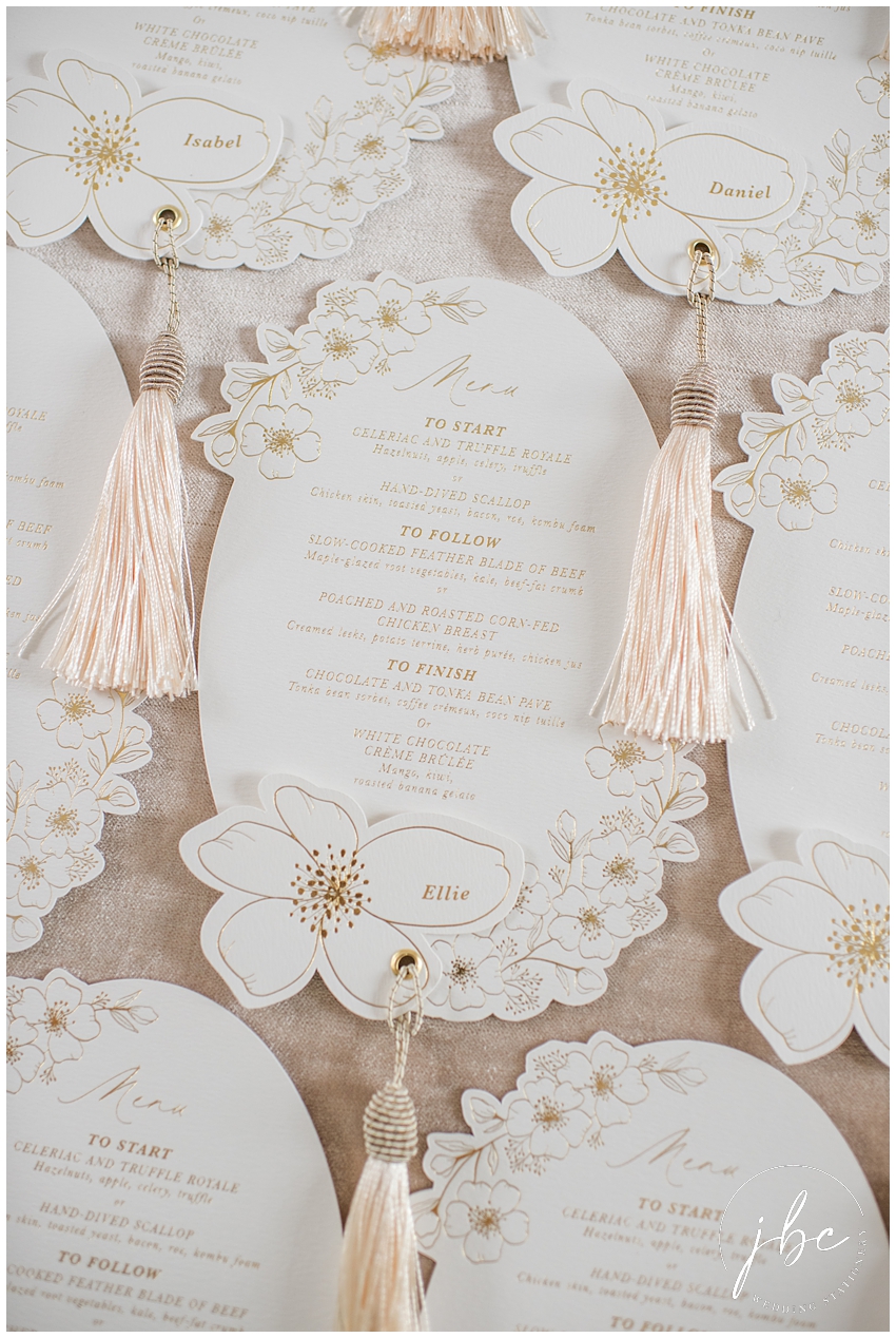Wedding menus and place names with flower place name. All menus pressed in gold foil with blossom flower details. Bespoke wedding stationery